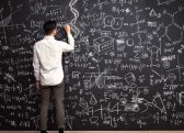 A person looking at a blackboard Description automatically generated with low confidence